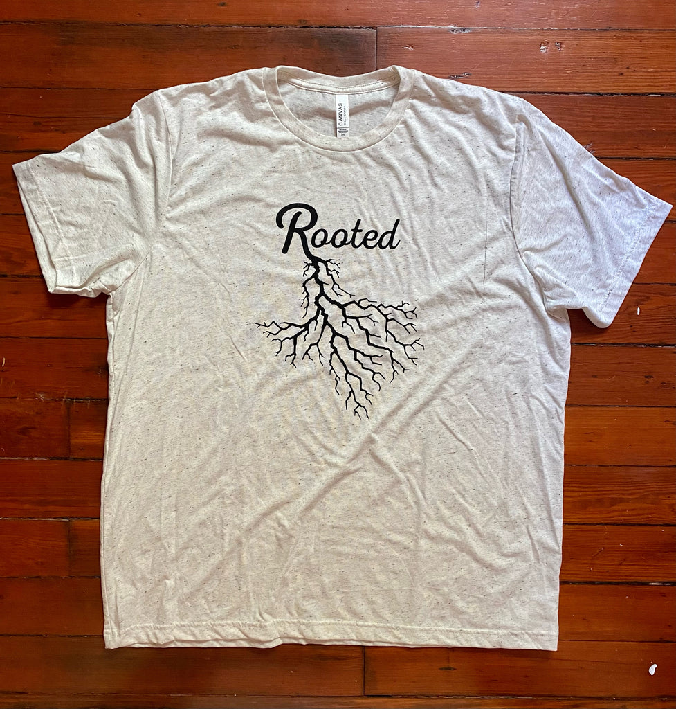 Oatmeal Triblend tee with Rooted in Texas design printed on front.