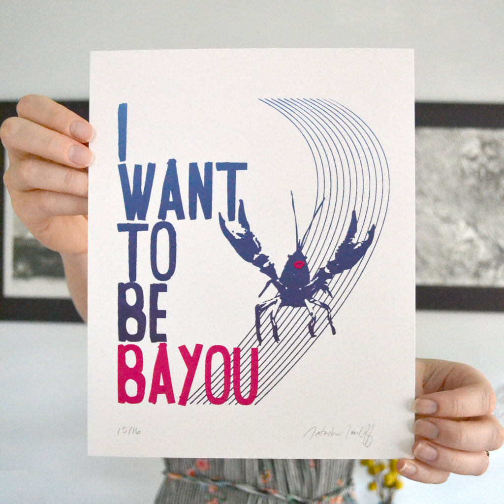 I want to be bayou crawfish print held up for a close up picture